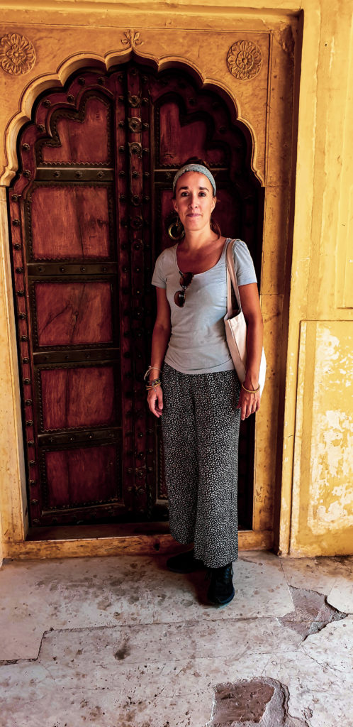 Me infront of an old wooden door inside the palace