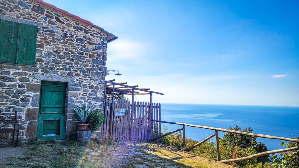 Cottage and ocean view of Cinque Terre in Italy. Your guide to renting a car in Italy. In the worlds jungle travel.