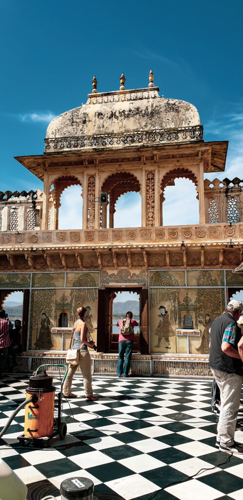 Courtyard at Udaipur Palace. Majestic palaces to visit or to stay at in Rajasthan, India. In the worlds jungle travel.