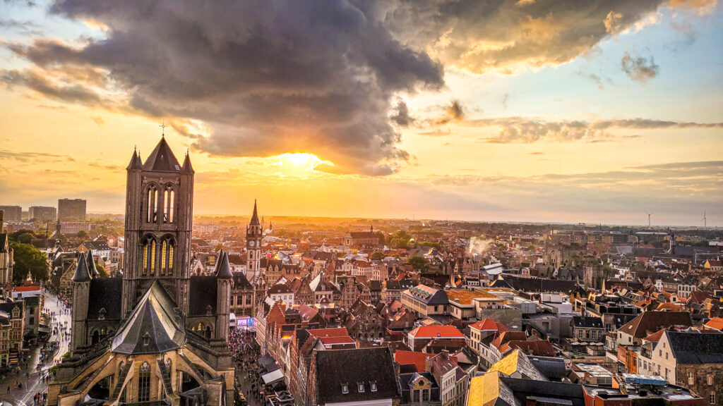 Sunset and view of the city of Ghent. Monumental highlights to visit in Ghent, Belgium. In the worlds jungle.