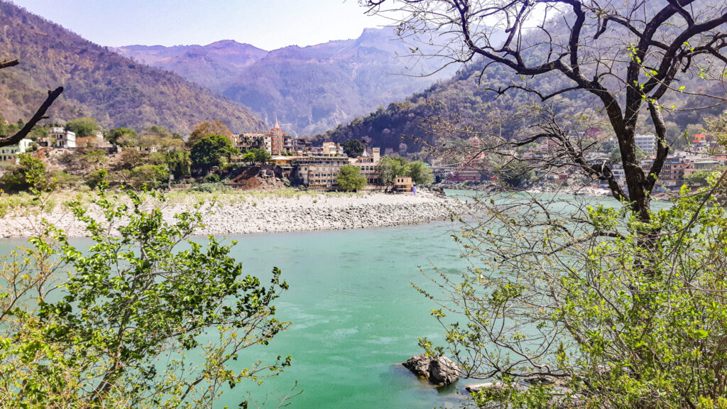 View of the Ganges river in Rishikesh. Beginners guide to travel India by train. In the worlds jungle. 