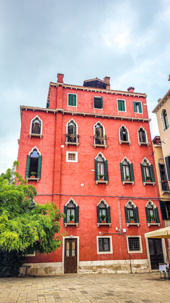 Red house in Venice. Monumental highlights to visit in Venice, Italy. In the worlds jungle.