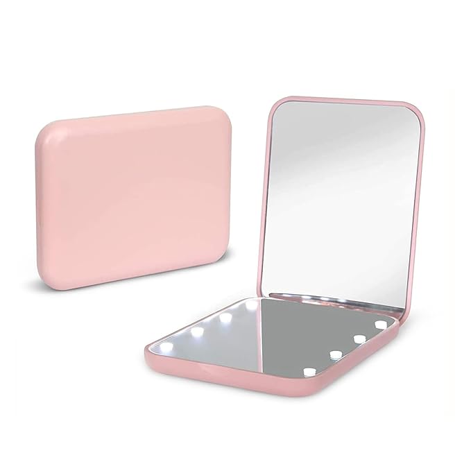 Travel makeup mirror with light. In the worlds jungle