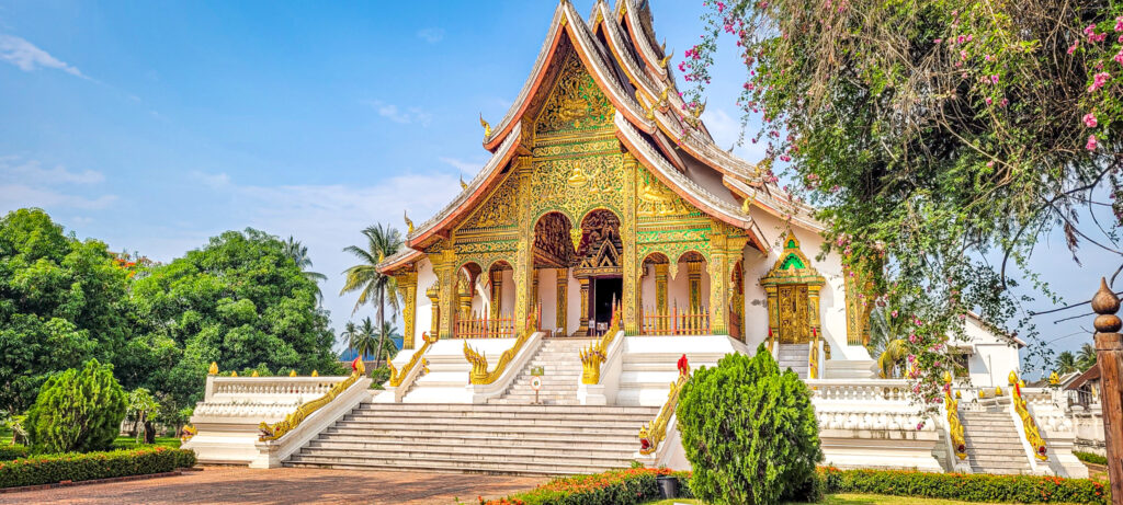 The garden and Haw Pha Bang temple at the Royal Palace museum. Cultural and natural highlights in Luang Prabang, Laos. In the worlds jungle travel blog.