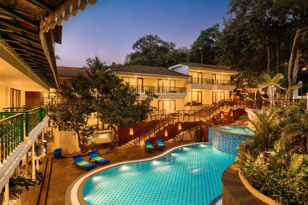 Swimming pool and garden at Storii By ITC Hotels, Shanti Morada. Goa Best luxury hotels & resorts in North Goa rated 8.5+ for an unforgettable getaway.