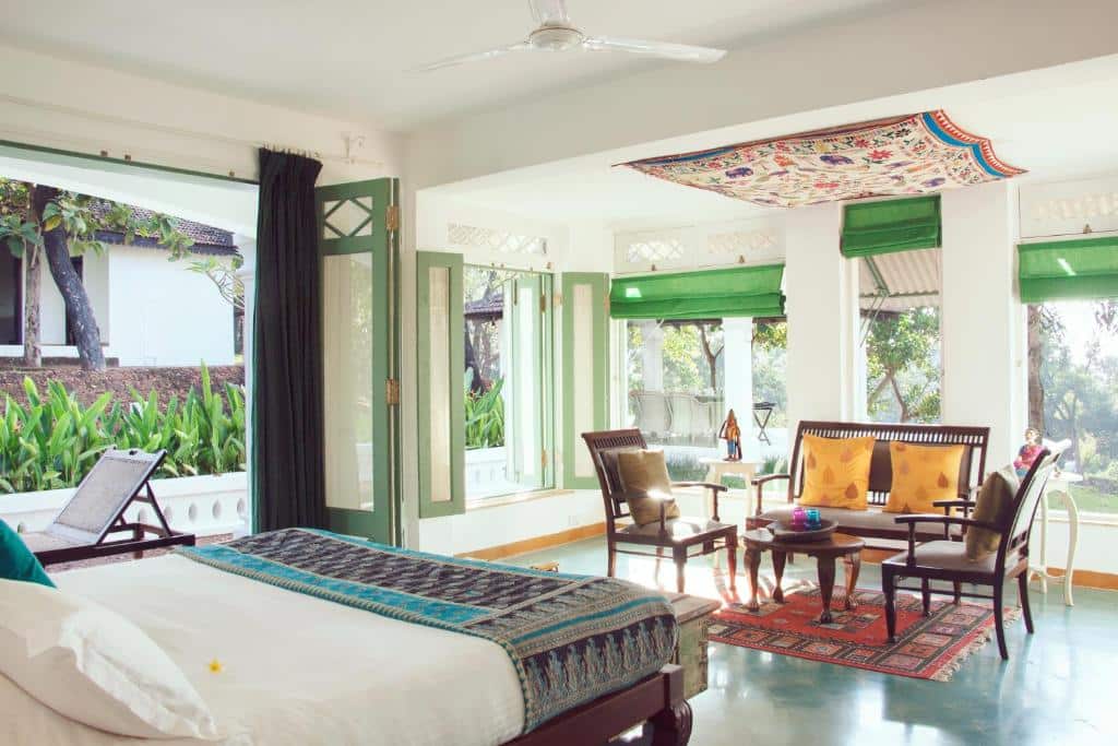 Lounge and garden view from room. The Postcard Velha. Best luxury hotels & resorts in North Goa rated 8.5+ for an unforgettable getaway.
