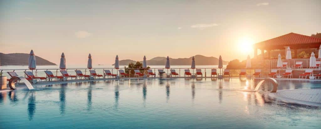 Sunset at the pool with view of the hills at Sun Gardens Dubrovnik.