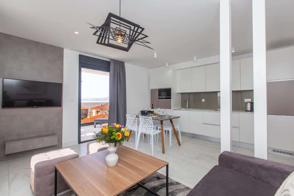 Livingroom and kitchen at Villa 23 A heated pool. Trogir & Čiovo Island: history, beaches, culture & coastal beauty