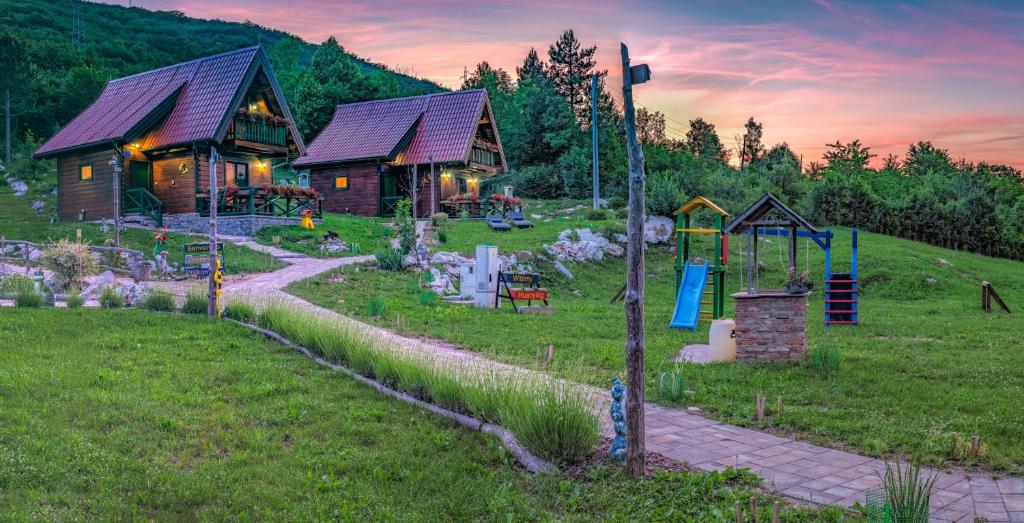Purple pink sunset with bungalow and garden view. Holiday Park Plitvice Paradise. Visiting Plitvice Lakes: tips, highlights, and where to stay