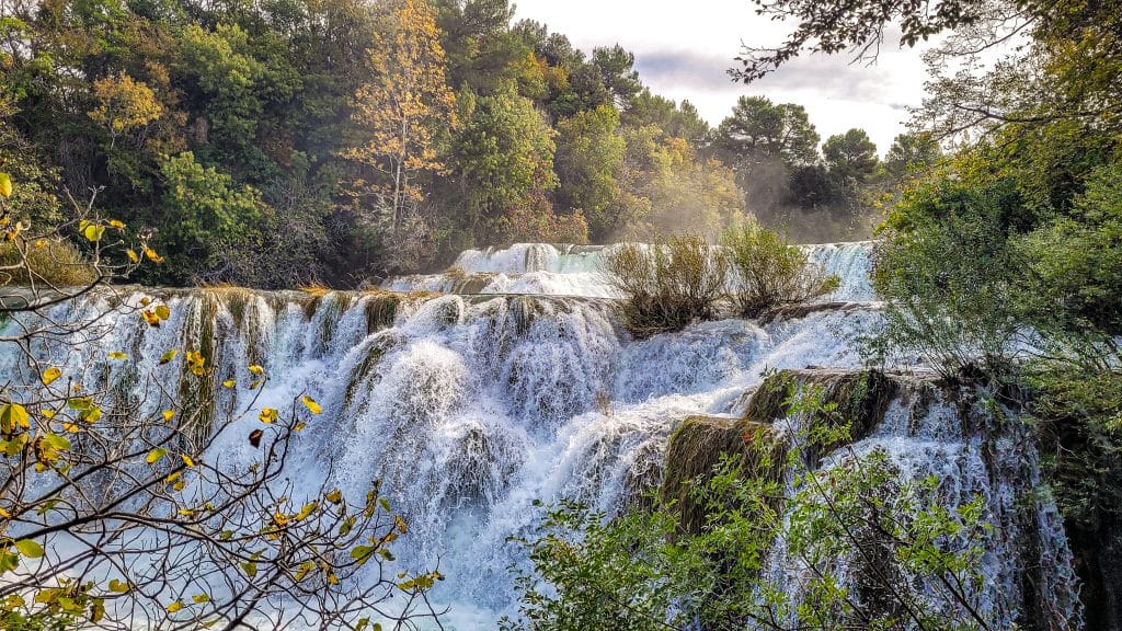 Skradinski Buk with fall foliage. Krka National Park, Croatia: Complete Visitor Guide to Waterfalls, Trails, and Tickets