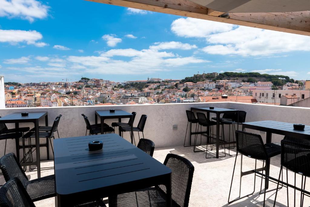 Terrace and scenic city view at Lisboa Pessoa Hotel. Lisbon Travel Guide: what to see, do, and know before you go