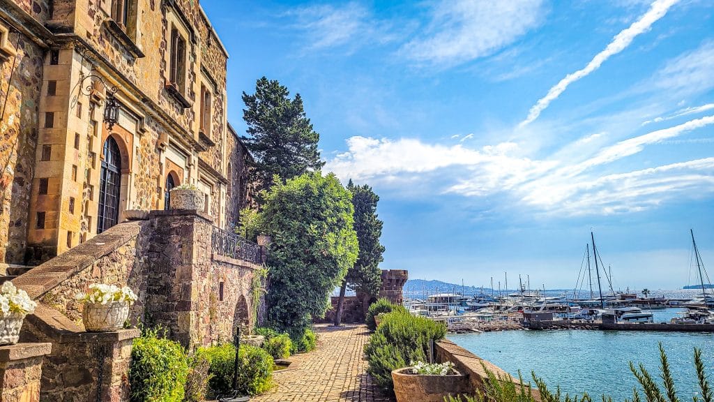 View of the yachts and historic building in Cannes in France. Europe on a budget: tips, tricks, and affordable destinations