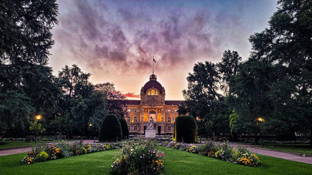 Pink purple sunset at the Opera in Strasbourg. Europe on a budget: tips, tricks, and affordable destinations