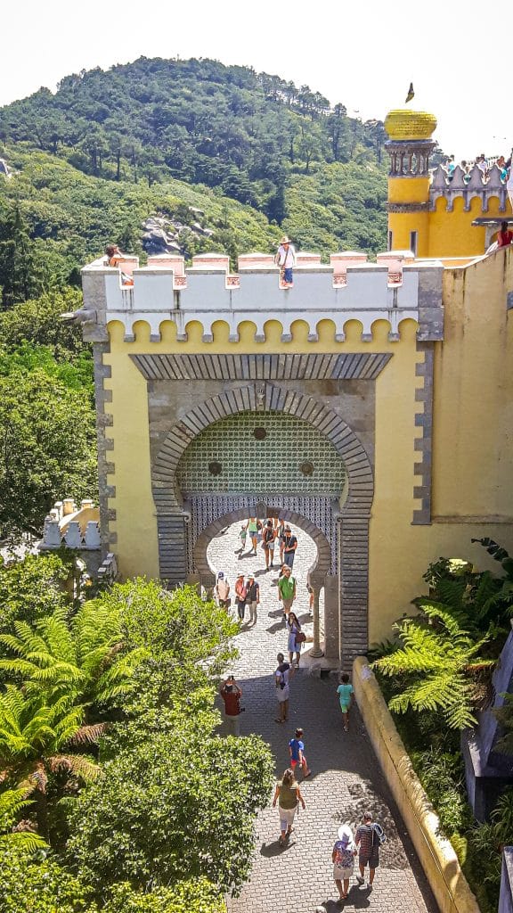 Colourful architecture at entrance gate of Pena palace in Sintra. Lisbon Travel Guide: what to see, do, and know before you go