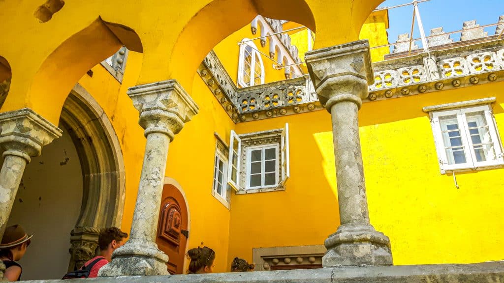 Yellow exterior architecture of Pena palace in Sintra. Lisbon Travel Guide: what to see, do, and know before you go