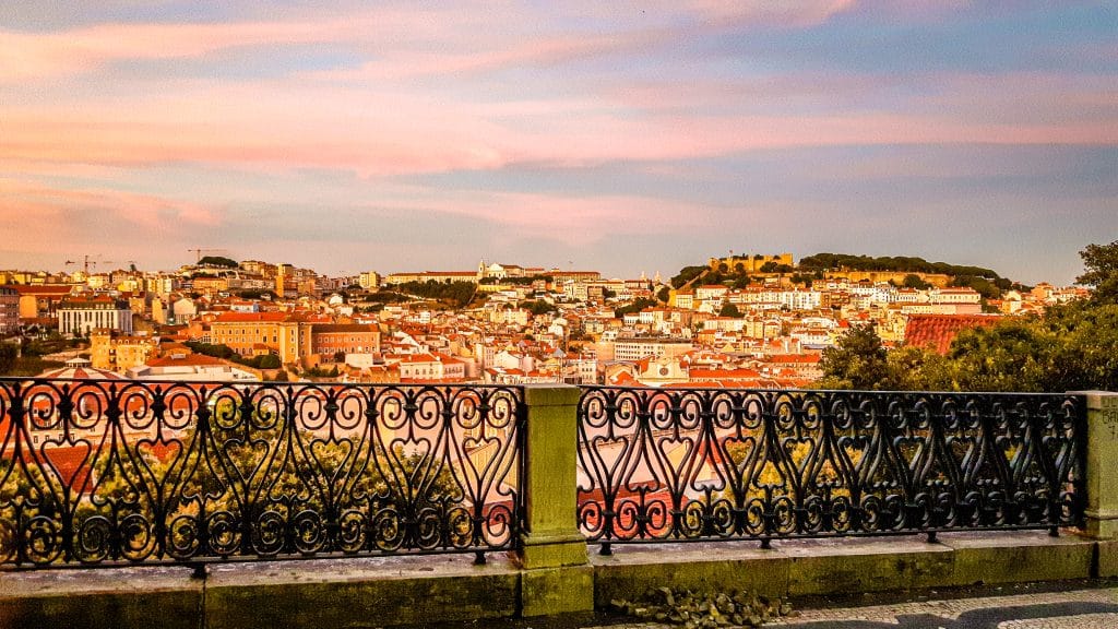 Pink sunset view of the city of Lisbon. Lisbon Travel Guide: what to see, do, and know before you go