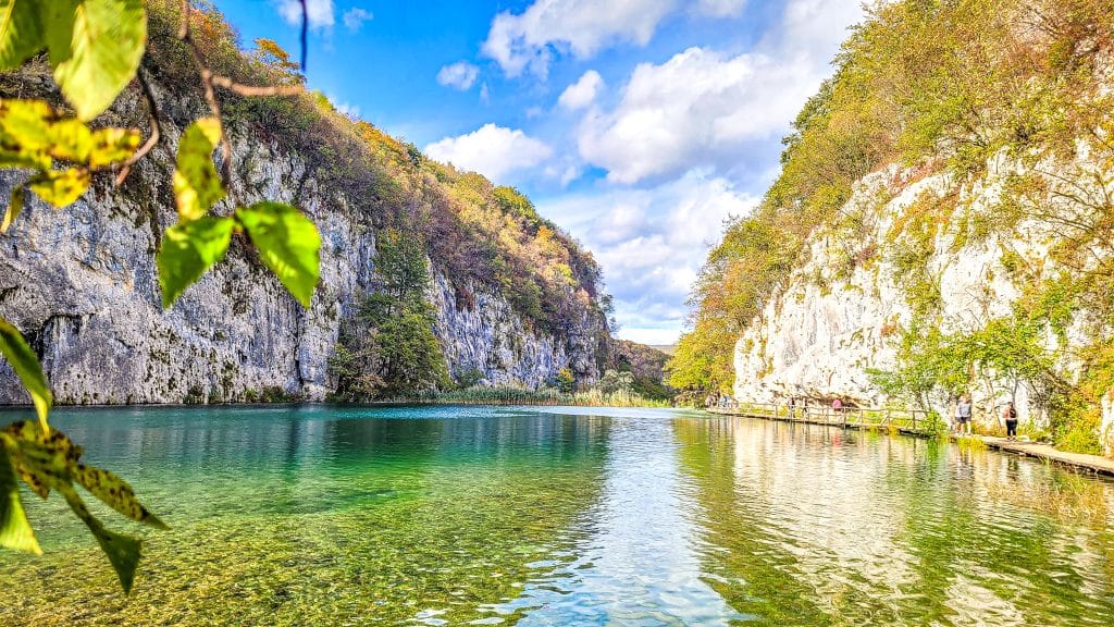 Rock formations, turquoise water and green forest landscape at the Plitvice lakes. Visiting Plitvice Lakes: tips, highlights, and where to stay