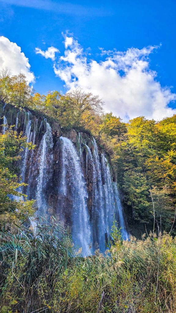Large waterfall and blue sky. Visiting Plitvice Lakes: tips, highlights, and where to stay