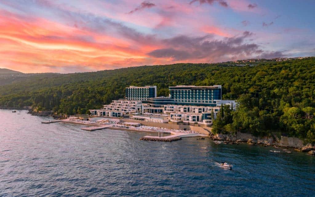Pink purple sunset with view of Hilton Rijeka Costabella Beach Resort and Spa. Visiting Rijeka, Croatia: highlights, best time to go & local eats