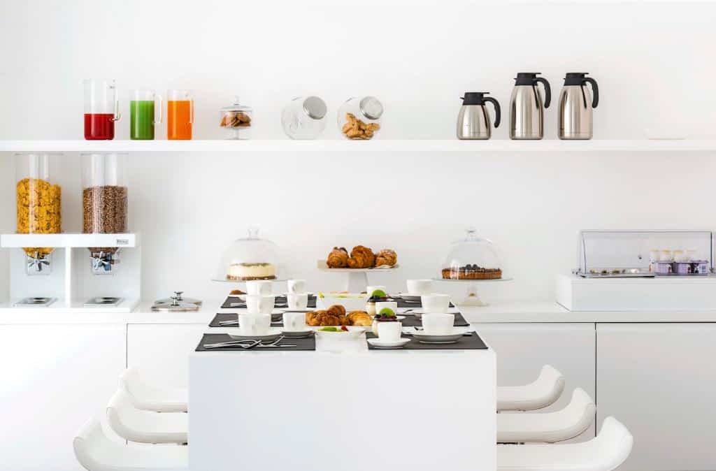 Dining area of a studio at Dilman Luxury Stay. Bari Travel Guide: Discover Hidden Gems in Puglia’s Capital. In the worlds jungle travel blog.
