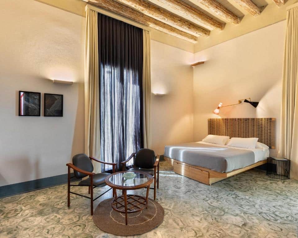 Bedroom at Palazzo Calò. Bari Travel Guide: Discover Hidden Gems in Puglia’s Capital. In the worlds jungle travel blog.