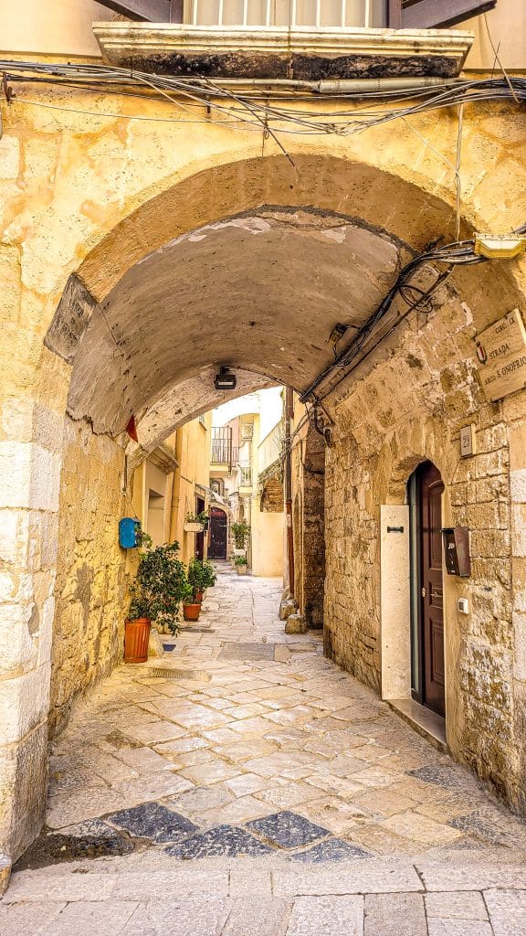 View of a cozy alley in the old city of Bari. Bari Travel Guide: Discover Hidden Gems in Puglia’s Capital. In the worlds jungle travel blog.