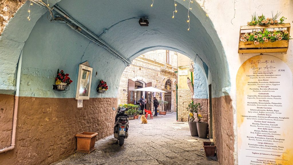 A gate at one of the many alleys in the old city of Bari. Bari Travel Guide: Discover Hidden Gems in Puglia’s Capital. In the worlds jungle travel blog.
