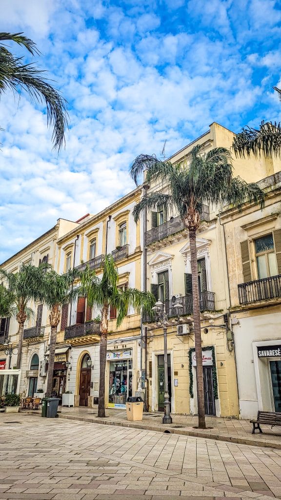 Palmtrees and architecture in Brindisi main street. Brindisi Travel Guide: Everything You Need to Know Before You Visit