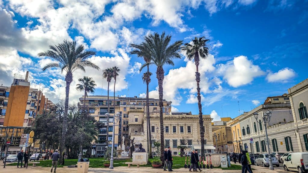 Palmtrees, sunny weather, blue sky at a square in Brindisi. Brindisi Travel Guide: Everything You Need to Know Before You Visit