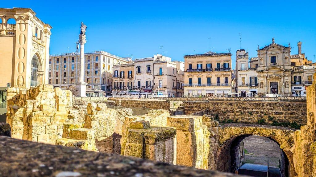 The Roman amphitheatre and column. Why Lecce Is Southern Italy's Most Underrated Travel Destination