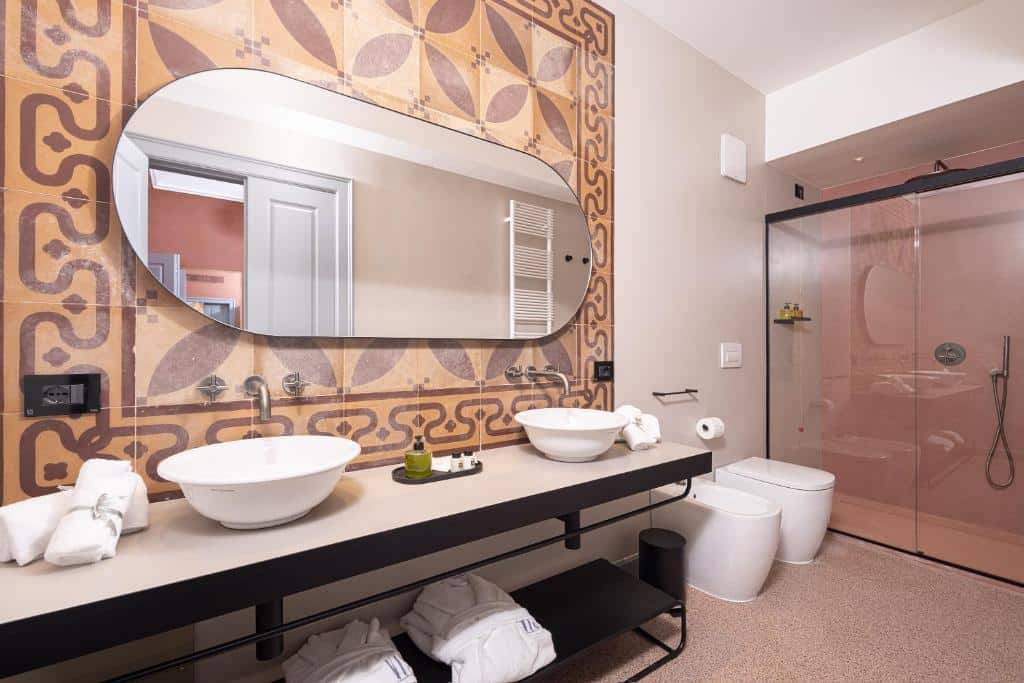 Bathroom at VIS Urban Suites & Spa - Boutique Hotel. Bari Travel Guide: Discover Hidden Gems in Puglia’s Capital. In the worlds jungle travel blog.